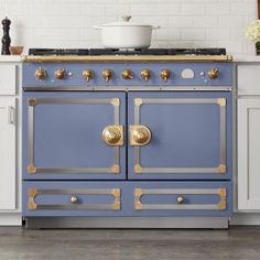 a blue and gold stove top oven in a kitchen