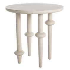 a white table with three wooden poles on the bottom and one leg in the middle