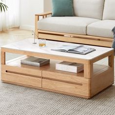 a living room with a white couch and coffee table