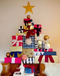 a christmas tree made out of wrapped presents