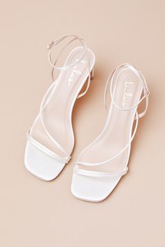 Keep things chic and simple by adding the Lulus Kierha White Satin Strappy Low Heel Sandals to any of your effortlessly elegant 'fits! Sleek woven satin shapes these darling heels that feature a square footbed and a trio of slender straps that cross the vamp. A matching strap wraps the front of the ankle and secures with a gold buckle, all atop a trendy blade heel. 2. 75" wrapped blade heel. Cushioned insole. Felted rubber sole has nonskid markings. Man made materials. Imported. Lulus | Kierha W Flat Homecoming Shoes, Small White Heels, Short White Heels, Homecoming Shoes Flats, White Short Heels, Small Heel Wedding Shoes, Dainty Sandals, Homecoming Shoes Heels, Low Heels Outfit