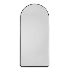 an arched mirror is shown against a white background and has black trim on the edges