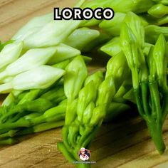 green asparagus on a cutting board with the words loroco