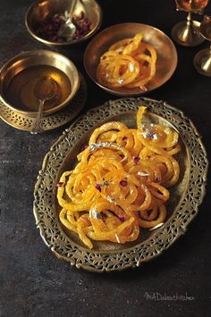 some food is sitting on a plate with other dishes around it