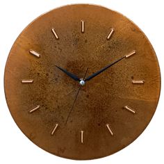 a brown clock with gold hands and numbers on it