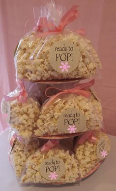 three bags of popcorn are stacked on top of each other with the words ready to pop