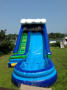 an inflatable water slide on the grass