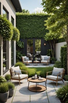 an outdoor living area with chairs, tables and plants