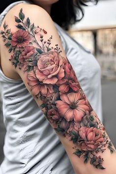 a woman's arm with flowers on it