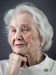 an older woman with white hair and blue eyes is featured on the cover of a book