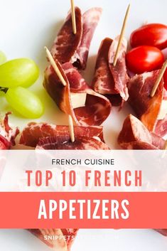 the top 10 french appetizers with grapes and meat on skewers in front of them