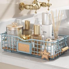 a bathroom sink with soap, lotion and star shaped toothbrushes in it