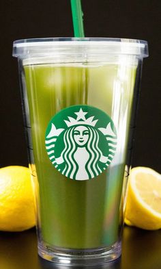 a starbucks drink with a straw and lemon