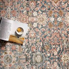 an open book on top of a rug