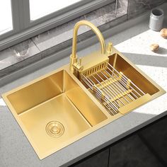 a kitchen sink that is gold in color