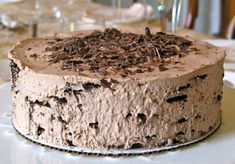 a chocolate cake sitting on top of a white plate