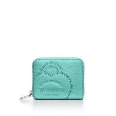 Inspired by one of the House’s most distinctive designs, Return to Tiffany® accessories are crafted in supple leather and embellished with details that nod to our iconic jewelry. This playful small wallet is embossed with our signature heart motif and finished with a knife-edge metal zipper pull. Interior card slots and two separate pockets keep your essentials tidy. Tiffany Blue® Taurillon leather; 3.9 x 3.2"; Six interior card slots; Palladium-plated knife-edge zipper pull; Nappa leather lining; Made in Italy | Return to Tiffany® Small Zip Wallet in Tiffany Blue® Leather Tiffany And Co Wallet, Tiffany Accessories, Iconic Jewelry, Return To Tiffany, Heart Motif, Tiffany And Co, Zip Wallet, Small Wallet, Tiffany Blue