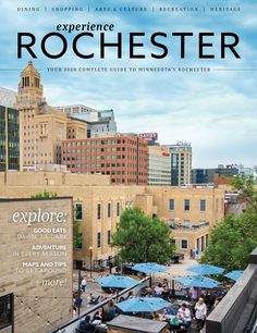 a magazine cover with an image of people eating outside on the roof top and buildings in the background