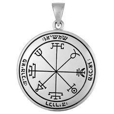 a silver pendant with an image of the seven symbols