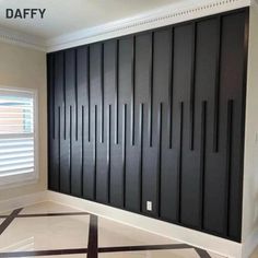 an empty room with black and white stripes on the floor