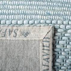 an upholstered piece of fabric with the word love written on it, in blue and white