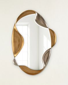 a mirror that is sitting on the wall