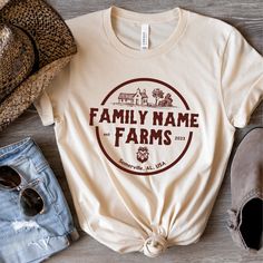 Customize this shirt with your family name, established year, and town of your home / farm. Great gift for newlywed, new home owner, farmer, chicken lover, etc... ❤️Love the design and want it in a sweatshirt? We got you covered. Tap here:  https://cottoncropshop.etsy.com/listing/1682115050/personalized-family-farm-sweatshirts SHORT SLEEVE TSHIRT FIT: ⚡️TAPERED SHOULDERS - so it retains its shape even after washing. ⚡️CREW NECKLINE adds a timeless, classic touch and a neat appearance that is per Family Farm Shirts, Family Farm Shirts Ideas, Farm T Shirt Ideas, Custom Text T-shirt For Family Gatherings, Personalized Cotton T-shirt For Family Gatherings, Custom Text Crew Neck Tops For Family Gatherings, Custom Text Crew Neck T-shirt For Family Gatherings, Funny Farm Shirts, Farm Shirts