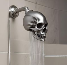 a skull head shower faucet with water running from it