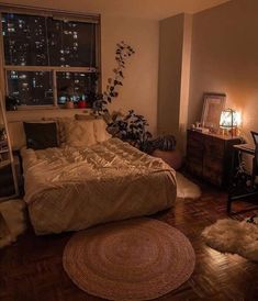 a bed room with a neatly made bed next to a window