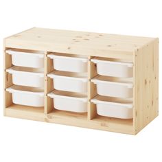 a wooden shelf with white containers on it