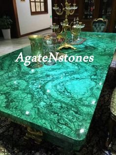 green marble dining table with gold accents