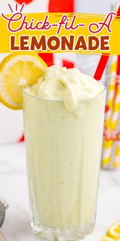 a lemonade drink in a tall glass garnished with whipped cream and a slice of lemon