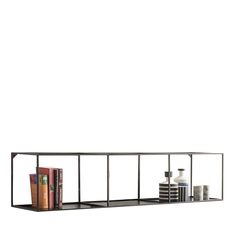 a metal shelf with books and other items on top of it, against a white background