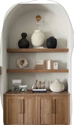 some shelves with vases and books on them