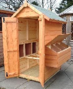 a small wooden shed with its door open