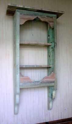 an old wooden shelf on the wall