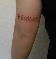 a person with a tattoo on their arm that reads,'reaum '