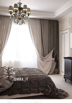 a bedroom with a chandelier hanging from the ceiling next to a bed in front of a window