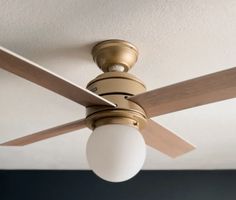 a ceiling fan with a light hanging from it