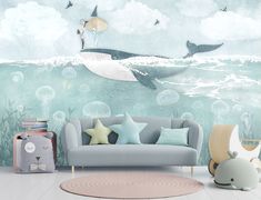 a living room scene with a whale wall mural