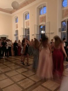 a group of people that are standing in the middle of a dance floor