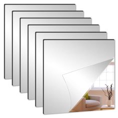 six white framed pictures on the wall