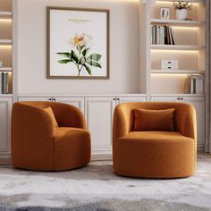 two orange chairs sitting in front of a book shelf