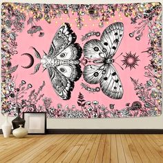 a pink wall with two butterflies on it and some lights hanging from the ceiling above