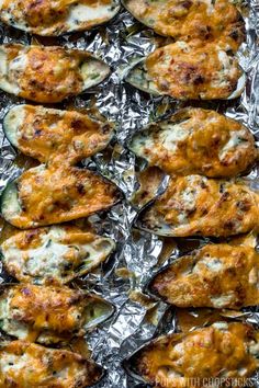 garlic cheese baked mussels in foil with text overlay that reads garlic cheese baked mussels