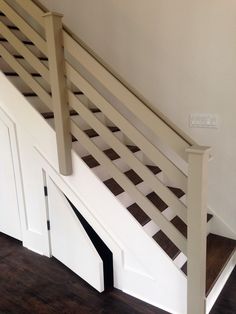 the stairs are made out of wood and white paint