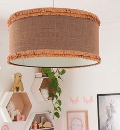 a lamp hanging from the ceiling in a child's room