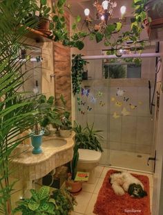 a bathroom with plants and a toilet in it