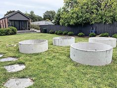 some concrete circles in the middle of a yard