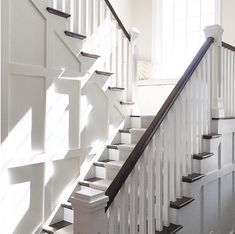 the stairs in this house are white and black